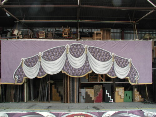 Thoroughly Theatre Stage Cloths & Props. Our Palace Red Border cloth is commonly used for scenes & shows such as Purple, Palace, ball room, Oriental, Theatre.